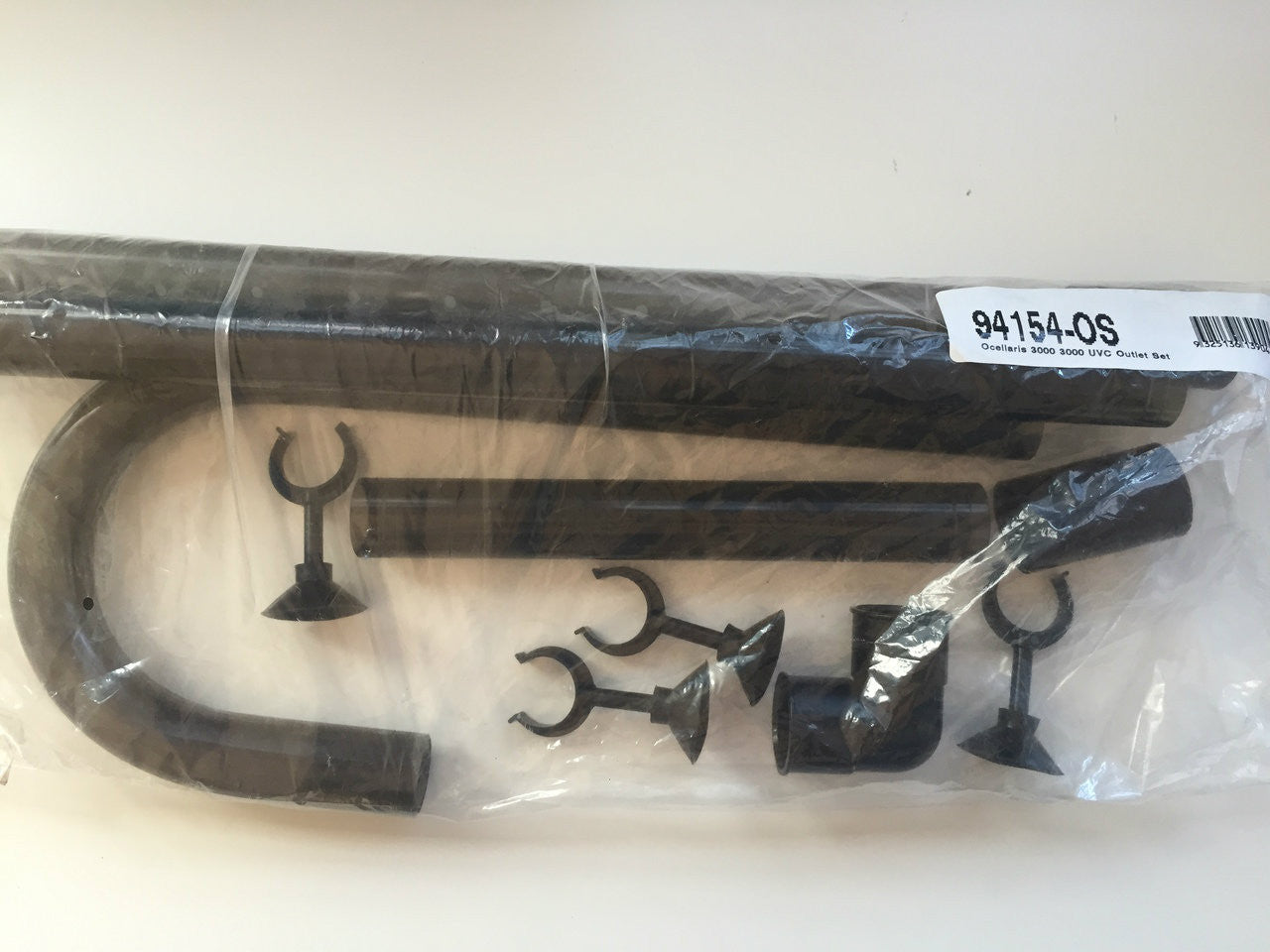 Plastic outlet tubing for a 3000/3000VC canister filter with accessories wrapped in a clear plastic bag