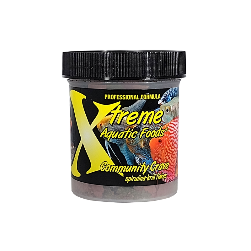 A clear container of Xtreme 14g Community Crave Flake fish food, showing the product name and description, alongside a label showing various fish.