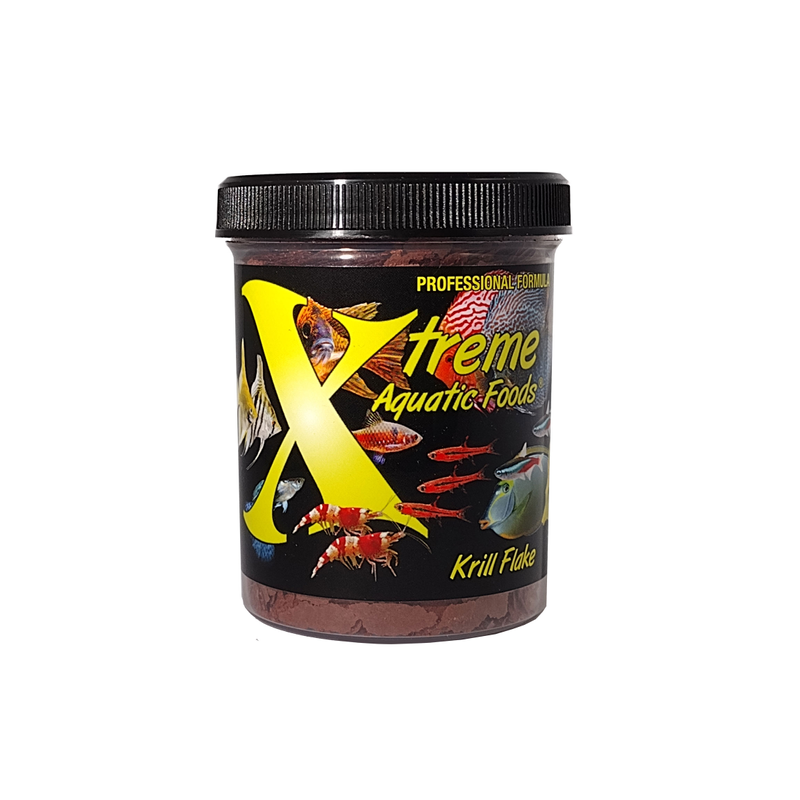 A clear container of Xtreme 28g Krill Flake fish food, showing the product name and description, alongside a label showing various fish and the size of the flakes.