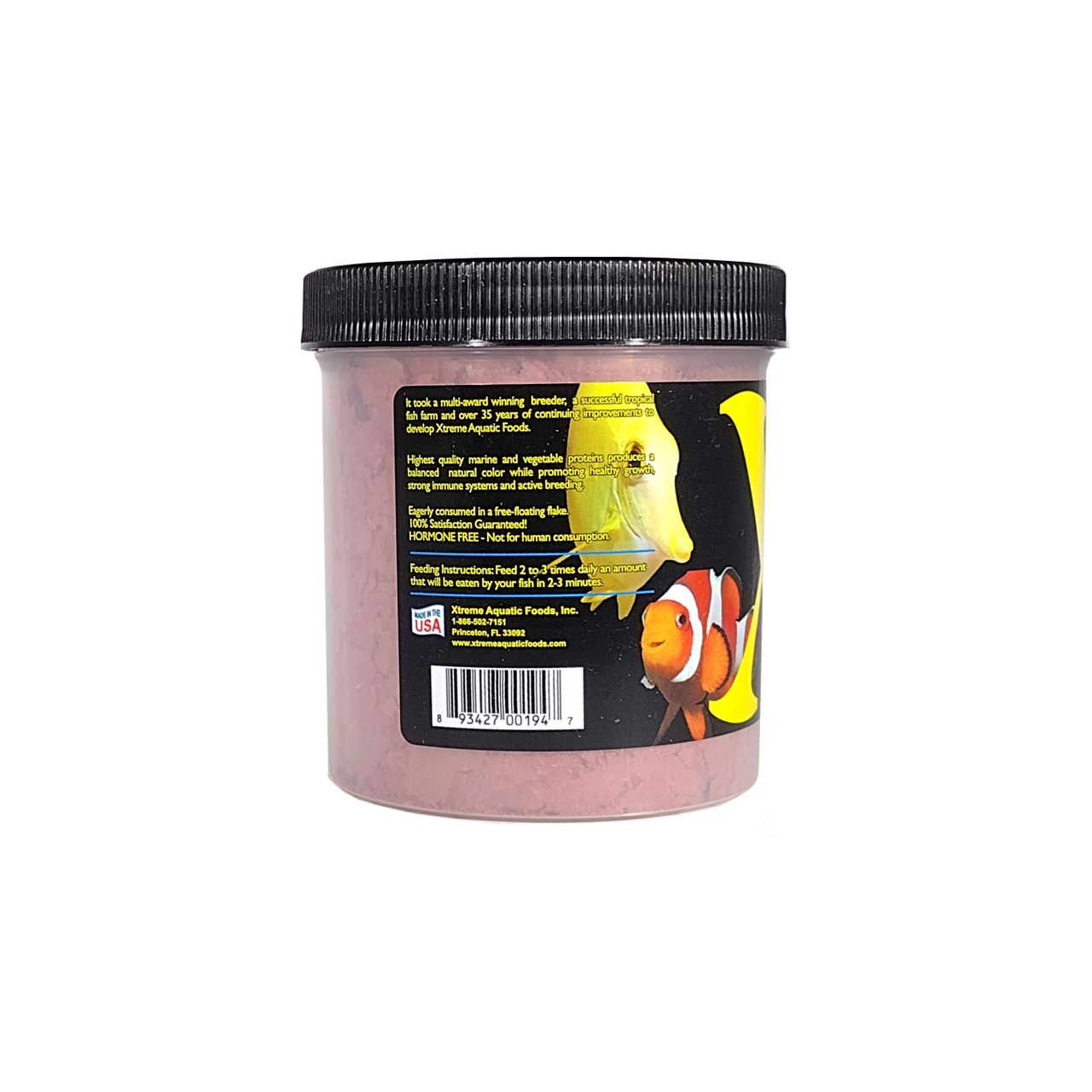 A clear container of Xtreme 56g Marine Krill Flake fish food, showing how the product was founded and the quality of the food alongside a label showing various happy fish.
