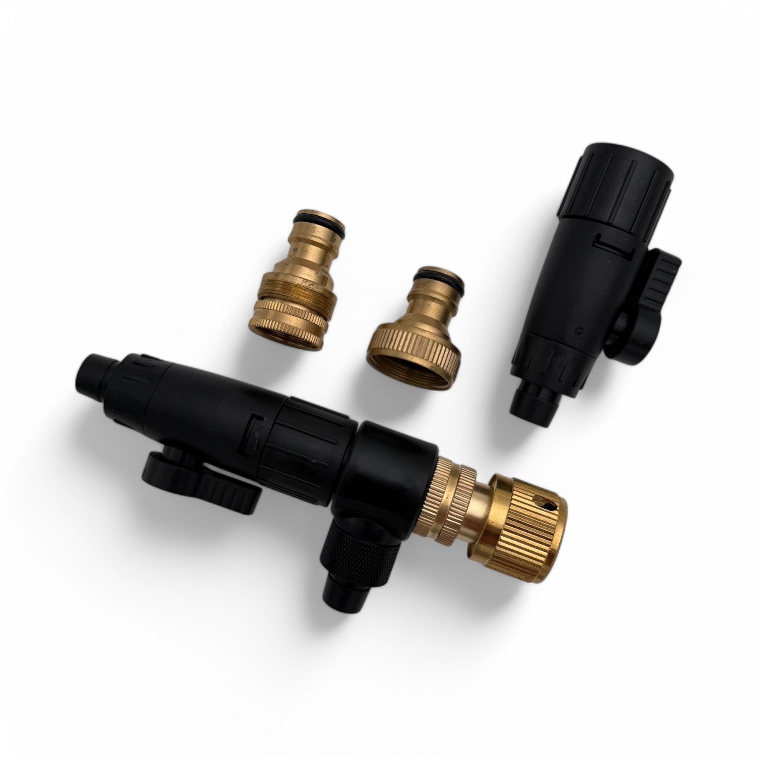 Set of black and brass garden nozzles on a white background
